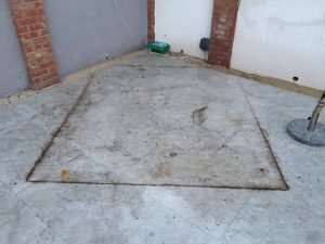 Before cleaning the patio is heavily marked and rust stained.