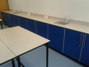 Clean desks and bench areas of a school science lab in Hampshire